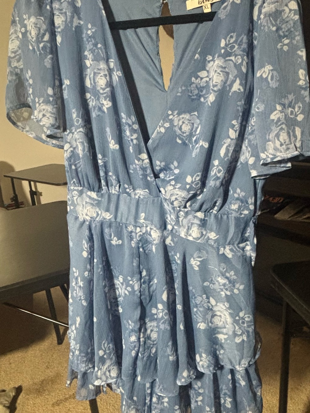 a blue floral wrap-style dress